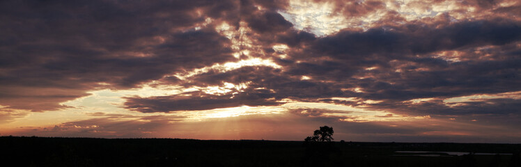 
sunset with purple clouds