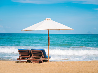 beach chairs and umbrella on the beach