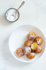 Doughnuts. Homemade cakes made from curd balls. Freshly made donuts from cottage cheese with powdered sugar. Cottage cheese donuts. Selective focus