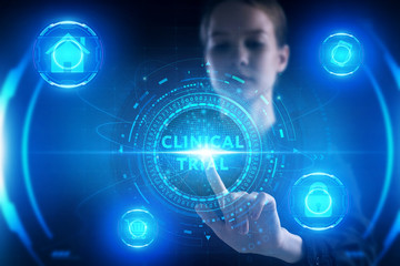 Business, Technology, Internet and network concept. Young businessman working on a virtual screen of the future and sees the inscription: Clinical trial