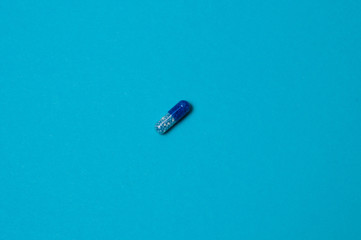 Pill on a blue background, isolate, with place for text.