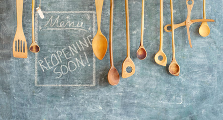 Restaurant display,announcing reopening after the corona lockdown,cooking, culinary concept on blackboard. Good copy space