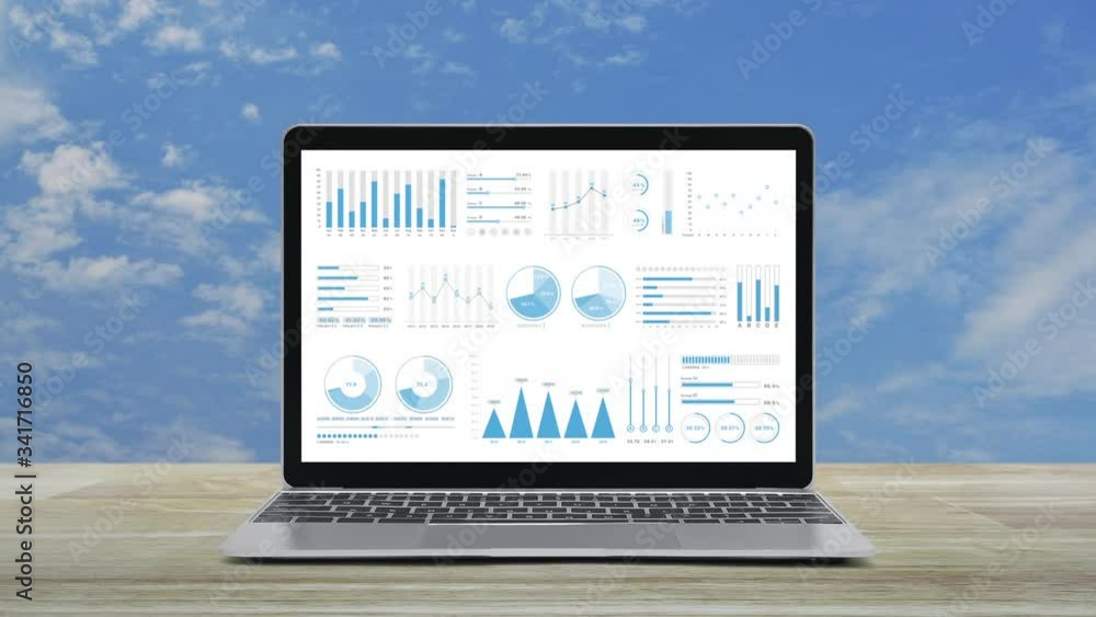 Poster statistics graphs, charts and diagrams data on modern laptop computer monitor screen on wooden table