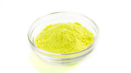 Yellow powder in bowl for playing Indian colorful festival