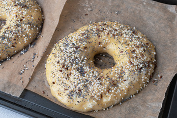 Homemade bagel preparation with sesame,poppy and flax seeds