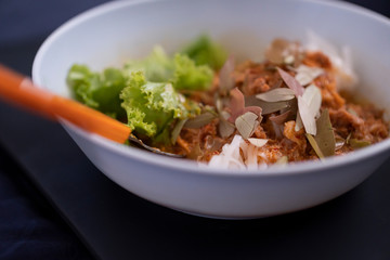 coconut rice noodles  topping with sweet sugar and vegetables, Thailand traditional snack