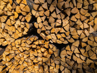 Large supply of stacked firewood