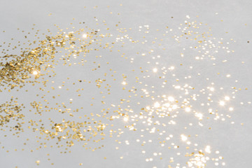 gold shiny glitter on silver background