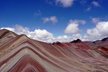 Blue skies and rainbow mountains