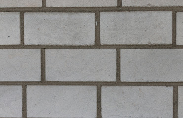 Obraz premium Detail of wall with white regular bricks