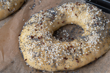 Homemade bagel preparation with sesame,poppy and flax seeds