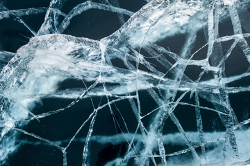 Texture of transparent ice with cracks on lake Baikal