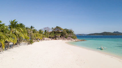 Aerial view on fantastic tropical white sand beach islands of Philippines. Coron island beach hopping