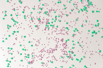 Minimal Easter composition. Multicolor backdrop for your design and text. Close up, flat lay.