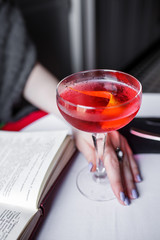 alcoholic cocktail in women's hands