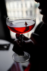 alcoholic cocktail in women's hands