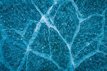 Texture of transparent ice with cracks on lake Baikal