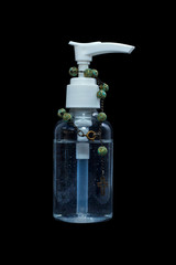 Coronavirus prevention , Bottle of hand sanitizer alcohol gel With a Wood rosary - black background 2