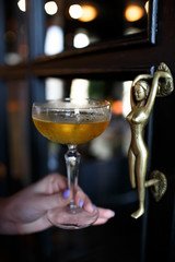 alcoholic cocktail in women's hands