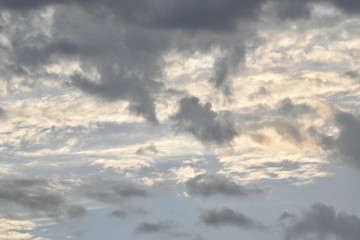 Dramatic sunrise and rainy storm sky with dark cloud.Abstract nature background.