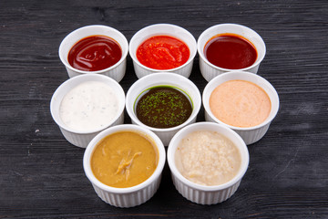 Sauces are collected, served with different dishes, fish, meat and garnish