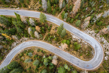 Aerial of a winding road in the Dolomites