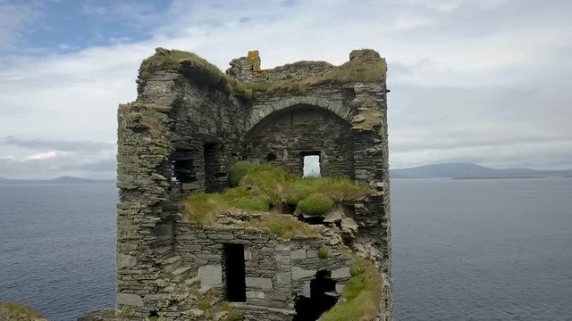 Aerial orbit of Irish ruined castle 