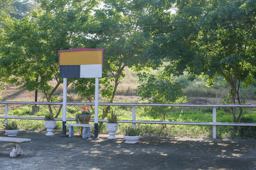 Blank sign located on train station have nature background