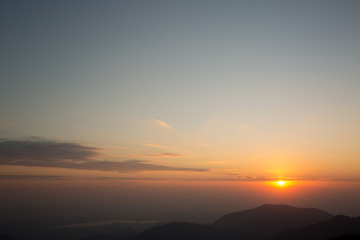 Fototapeta na wymiar silhouette mountain have little bit cloud and sunrise background