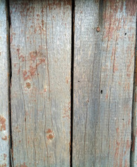 Fototapeta premium texture of old painted shabby rustic wooden fence made of planks, with rusty nails, grunge background