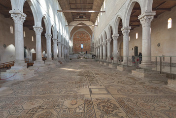 Interior of early christian basilica in Aquileia with famous mosaics, Friuli, Venezia Giulia, Italy