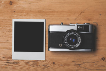 vintage retro camera with a blank instant photograph frame