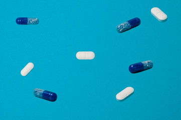 Pattern, pills or pills on a blue background
