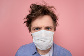 man with shaggy hairstyle and medical mask. I urgently need a hairdresser
