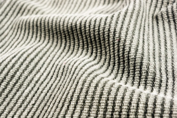 clothing items stonewashed cotton fabric texture with seams, clasps, buttons and rivets, macro