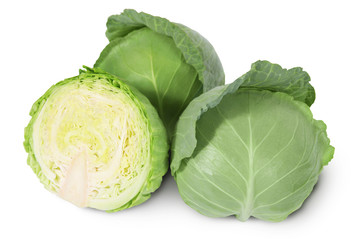 Group of green heads of white cabbage with sliced one on a white background