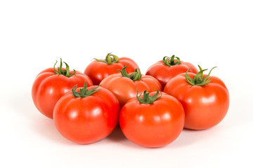 Red fresh tomatoes on a white background