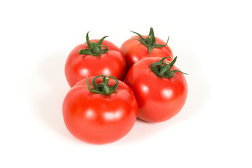 Group of red fresh tomatoes on a white background