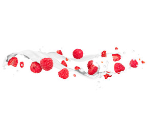 Whole and sliced raspberries with milk splashes
