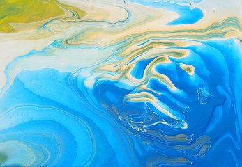 art photography of abstract marbleized effect background. Blue, gold and white creative colors. Beautiful paint