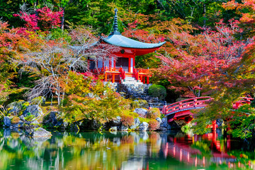 Fototapeta premium Japanese Traveling. Famous Daigo-ji Temple During Beautiful Red Maples Autumn Season at Kyoto City in Japan. With Pond Reflections in Foregorund.