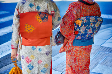 Kyoto Traveling. Geishas in Traditional Japanese Kimono and Backpacks Posing in Kyoto City,  Japan.
