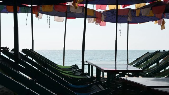parasol umbrella and chair bed on coast sand Bangsaen beach, Chon Buri at Thailand