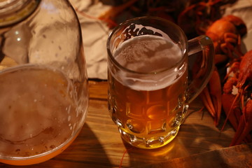 Crayfish with beer on a wooden table