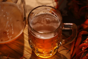 Crayfish with beer on a wooden table