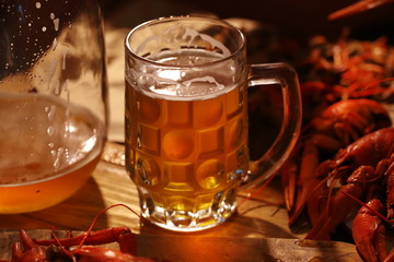 Crayfish with beer on a wooden table