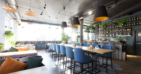 Empty bar counter interior in modern cozy cafe, panorama - obrazy, fototapety, plakaty