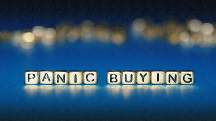 Beads with words "Panic Buying". Selected focus.