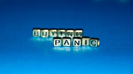 Beads with words "Panic Buying". Selected focus.