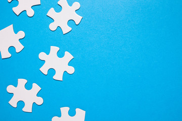 puzzle for teamwork. Playing jigsaw game. blue background and copy space